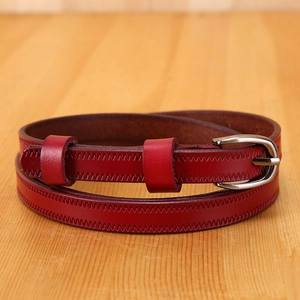 Deep red leather belt for women with unique Z-shaped stitching and silver buckle