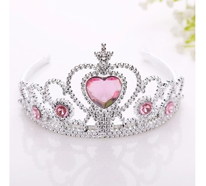 Detailed view of silver princess tiara with pink heart gems and floral accents