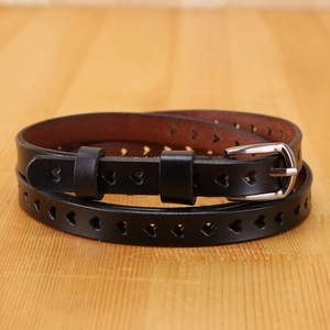 Women's black leather belt with hollow heart-shaped cutouts and a silver metal pin buckle