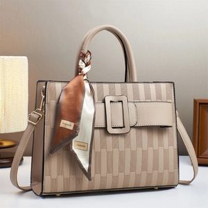 Detail of beige embossed tote bag with rectangle buckle and fashion print silk scarf