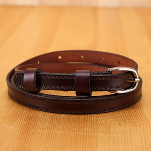 Minimalist genuine leather belt for women in dark brown featuring silver metal buckle