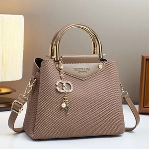 Chic khaki woven crossbody bag with gold metal handle and luxury charm detail