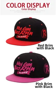 Detailed view of 3D embroidery and flat brim design on these two-tone snapback baseball caps