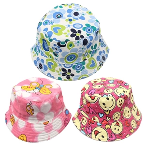 Three children's cotton bucket hats with colorful floral, butterfly, and heart prints