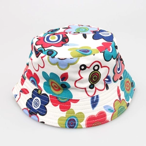 Detail of white cotton fisherman hat with vibrant colorful floral pattern print