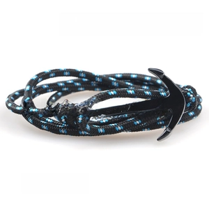 Close-up of nautical anchor bracelet with black, blue and white nylon braided rope