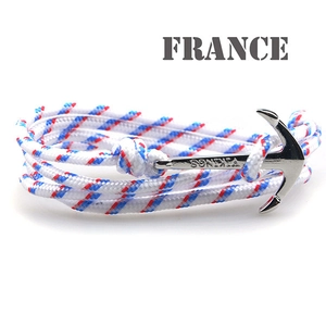 Close-up of silver anchor clasp with Vikings engraving and red white blue woven cord