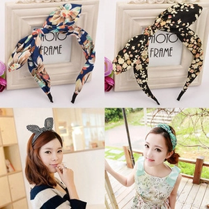 Detail showing floral and striped velvet headbands with bow design on model and photo frame