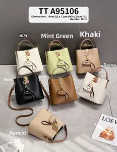 Sac seau en cuir litchi en sept couleurs avec bandoulière et détails de taille
