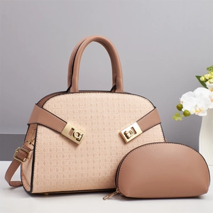 Detail of beige tote bag set with geometric texture, matching coin purse and gold hardware