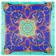 Detailed close-up of a square silk scarf with navy blue floral and equestrian prints
