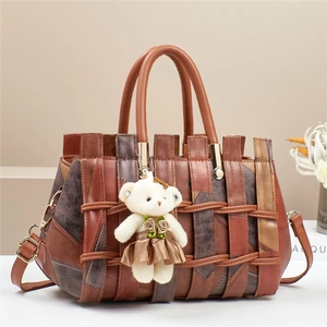 Retro brown leather crossbody bag with woven texture and a cute bear plush pendant
