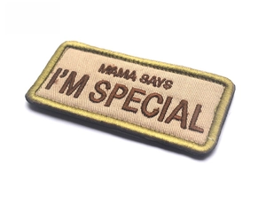 Detailed embroidery view of Mama Says I'm Special patch with golden edge stitching
