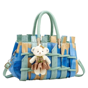 Chic multi-color woven crossbody bag with cute plush bear charm and adjustable strap
