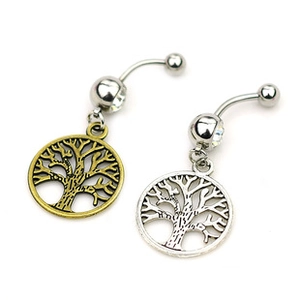 Detailed view of silver and bronze belly rings featuring tree of life charms with crystals