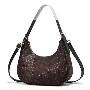 Fashionable dark brown croissant shoulder bag with snake skin pattern and gold hardware