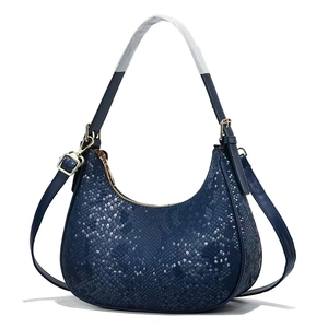 Deep blue hobo dumpling bag with faux snakeskin texture and elegant golden zipper
