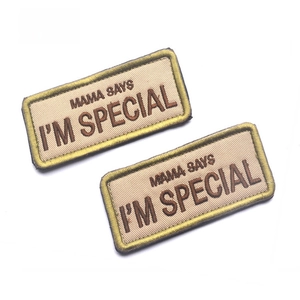 Close-up of Mama Says I'm Special embroidered patches with khaki twill and brown thread