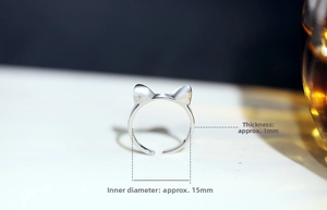 Macro shot of silver cat ear ring showing 15mm diameter and 1mm thickness details
