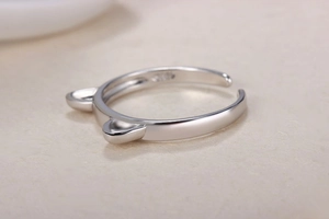 Macro view of S925 silver cat ear ring showing engraved hallmark and polished finish