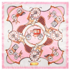 Flat lay of pink and white square silk scarf with vintage horse carriage and wheel patterns