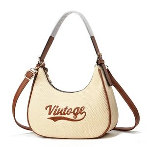 Retro beige woven hobo bag with vintage embroidery and adjustable brown shoulder strap