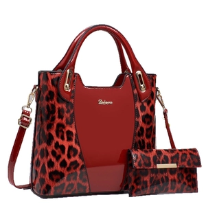 Red and black leopard print patent leather handbag set with matching long wallet