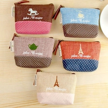 Detailed top view of five canvas coin purses with polka dots and creative zipper design