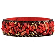 Detail of red stone beads and brass accents on a wide leather wrap bracelet