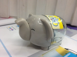 Detail view of cartoon elephant pencil sharpener in grey and transparent plastic