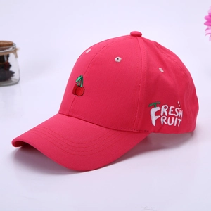 Close-up of cherry embroidery and Fresh Fruit text on rose red cotton baseball cap