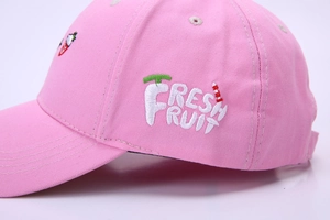 Close-up of pink cotton baseball cap with 3D fresh fruit strawberry embroidery