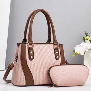 Pink woven handbag set with brown leather straps and gold hardware for women