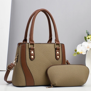 Chic woven tote bag and clutch set with brown leather straps and gold rivet accents