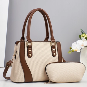Chic beige woven tote bag with brown leather trim and matching small clutch set