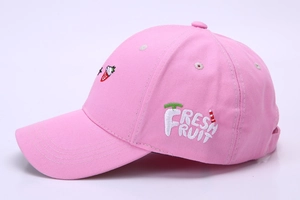 Detail of pink canvas baseball cap featuring white Fresh Fruit embroidery and strawberry logo