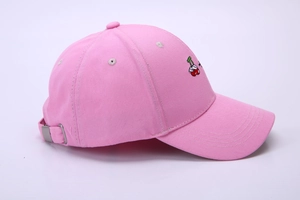 Detail of adjustable metal buckle and stitching on pink cotton baseball cap