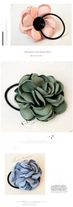 Detail of handmade fabric flower hair scrunchies in pink, green and blue colors