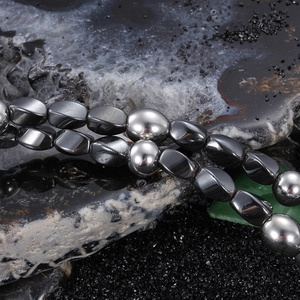 Men's punk lion head pendant on deep grey magnetic bead necklace with a metallic luster