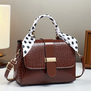 Brown crocodile pattern handbag with silk scarf handle and golden metal buckle