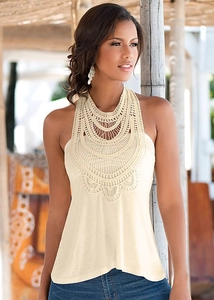 Detailed view of apricot crochet embroidery on a sleeveless halter top for women