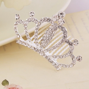 Close-up of sparkling rhinestones on a silver crown hair comb for girls' hair styling
