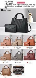 Detail view of textured PU leather handbags with vertical stripes and metallic hardware