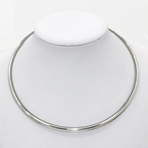 Minimalist punk style silver metal choker necklace displayed on a white jewelry bust