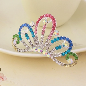 Close-up of a colorful rhinestone tiara hair comb with sparkling floral crystals