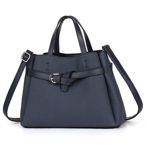 Navy blue faux leather tote bag with crossbody strap and silver buckle detail