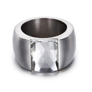 Macro detail of silver titanium steel ring featuring a large rectangular faceted glass stone
