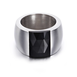 Detailed macro view showing the wide silver steel band and faceted square black gemstone