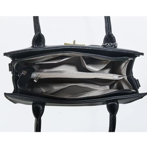 Interior view showing three compartments and zipper pocket of black pebble leather bag