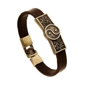 Detailed view of brown multi-layer leather bracelet featuring bronze yin yang metal charms